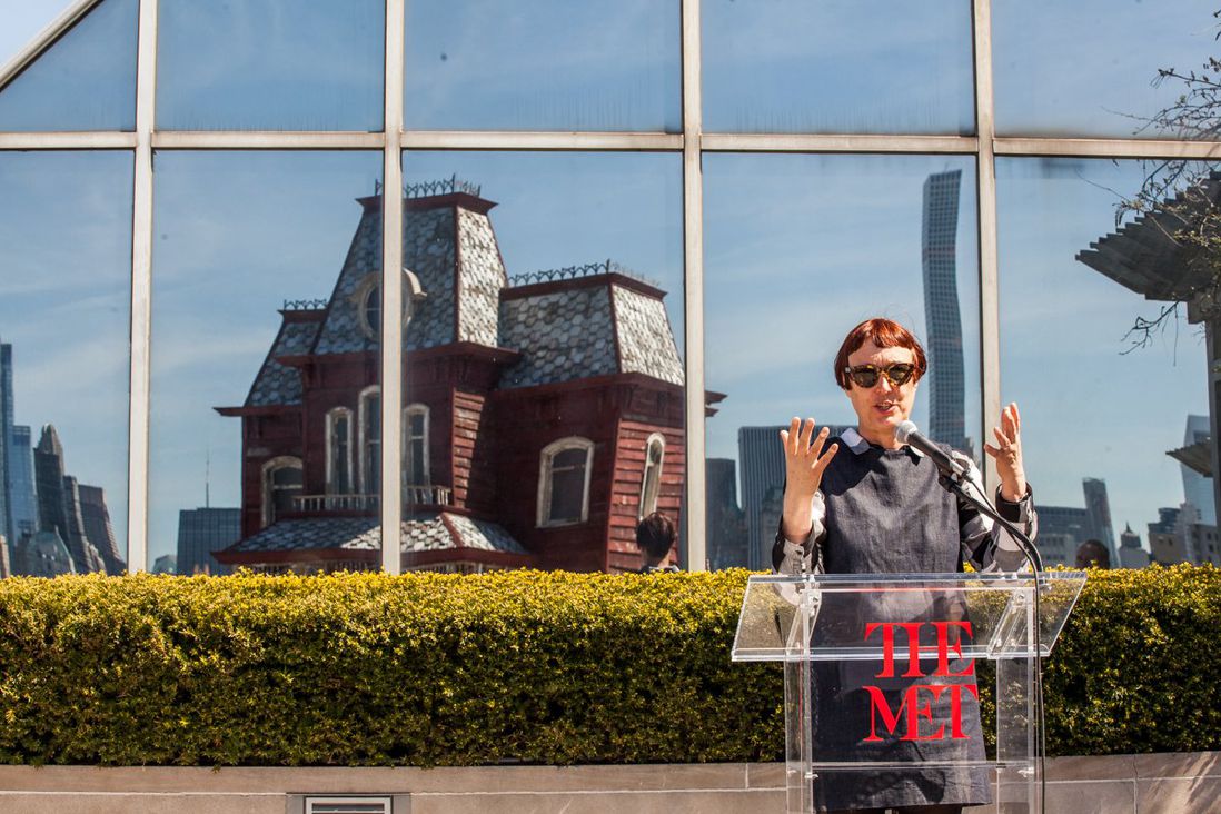 PsychoBarn's creator, Cornelia Parker, with her piece's reflection on the Met rooftop<br>